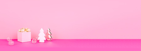 Christmas tree balls on a pink background with a place for your text.の写真素材