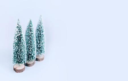 Christmas tree over light blue background. Xmas and holiday concept.の写真素材