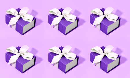 Pattern made of blue gift boxes on pastel background.の写真素材