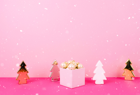 Christmas tree balls on a pink background with a place for your text.の写真素材