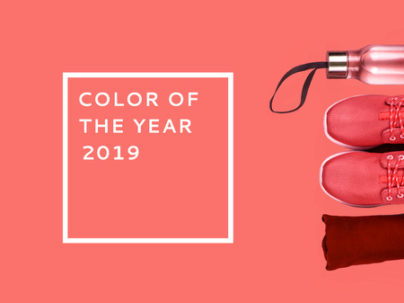 Creative flat lay of sport and fitness equipments on Living Coral background. Color of the year.の写真素材