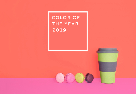 Cup of coffee to go with macarons on trendy background. Color of the year 2019.の写真素材