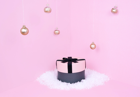 Pink gift box on pastel background. Xmas and holiday conceptの写真素材