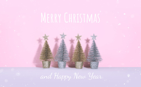 Christmas tree over pink background. Xmas and holiday concept.の写真素材