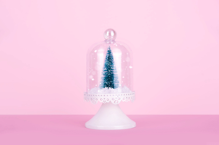 Creative Christmas design on pink pastel color background with Christmas tree. Xmas and holiday concept.の写真素材