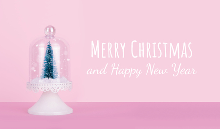 Creative Christmas design on pink pastel color background with Christmas tree. Xmas and holiday concept.の写真素材
