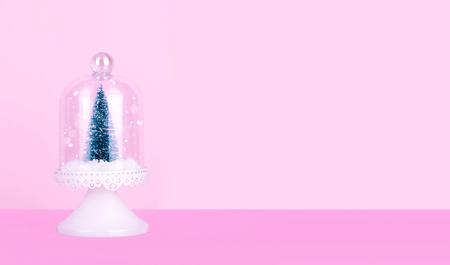 Creative Christmas design on pink pastel color background with Christmas tree. Xmas and holiday concept.の写真素材