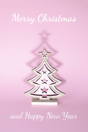 Christmas tree over pink background. Xmas and holiday concept.の写真素材
