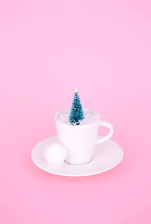 Creative Christmas design on pink pastel color background with Christmas tree. Xmas and holiday concept.の写真素材
