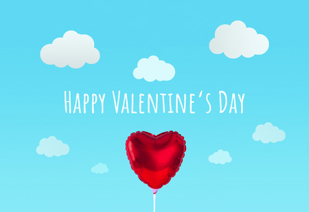 Red heart balloon on blue sky background. Creative minimal love concept.の写真素材