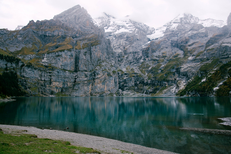 Caumasee lake with a small island located in the middle of the crystal clean lake, near Flims, Switzerland.の写真素材