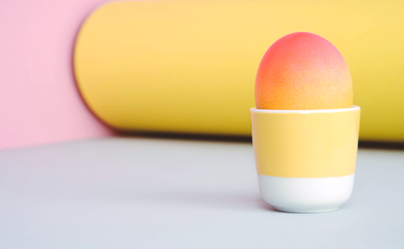 Painted eggs on pastel background. Creative minimal concept.の写真素材