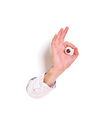 Hand ok sign on white background. Creative minimal concept.の写真素材