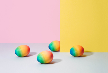 Painted eggs on pastel background. Creative minimal concept.の写真素材