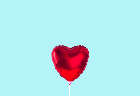 Red heart balloon isolated on trendy background.の写真素材