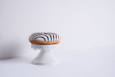 Striped donuts on a white background. Stylish minimal conceptの写真素材