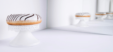 Striped donuts on a white background. Stylish minimal conceptの写真素材