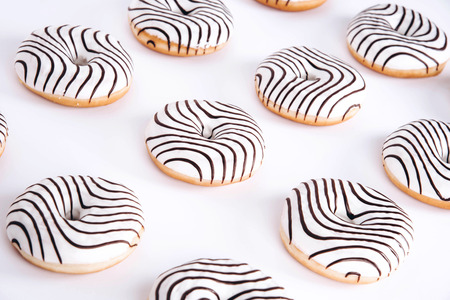 Striped donuts on a white background. Stylish minimal conceptの写真素材