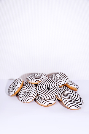Striped donuts on a white background. Stylish minimal conceptの写真素材