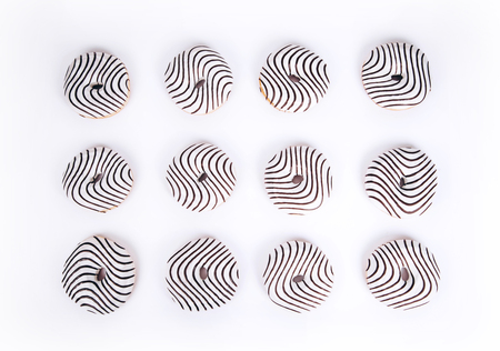 Striped donuts on a white background. Stylish minimal conceptの写真素材