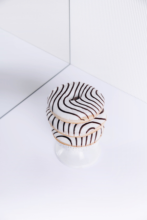 Striped donuts on a white background. Stylish minimal conceptの写真素材