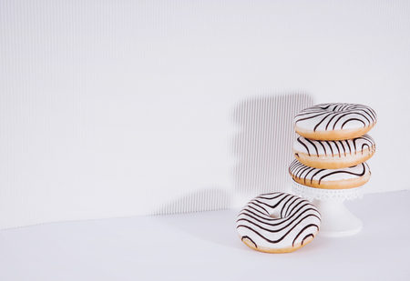 Striped donuts on a white background. Stylish minimal conceptの写真素材