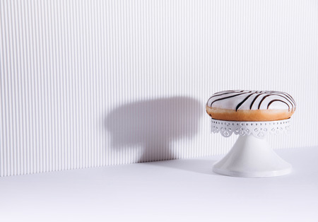 Striped donuts on a white background. Stylish minimal conceptの写真素材