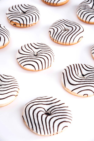 Striped donuts on a white background. Stylish minimal conceptの写真素材