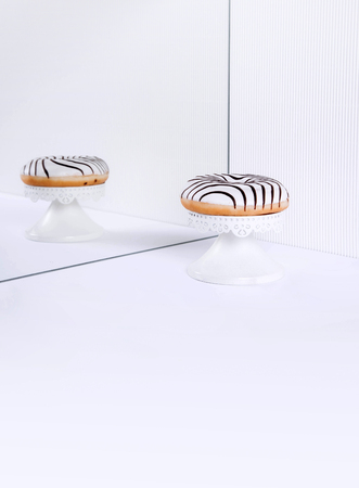 Striped donuts on a white background. Stylish minimal conceptの写真素材