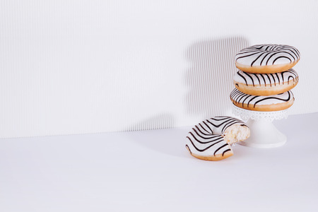Striped donuts on a white background. Stylish minimal conceptの写真素材