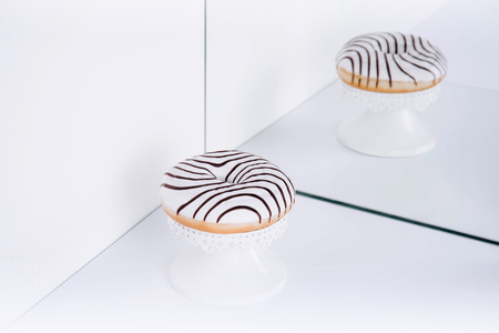 Striped donuts on a white background. Stylish minimal conceptの写真素材