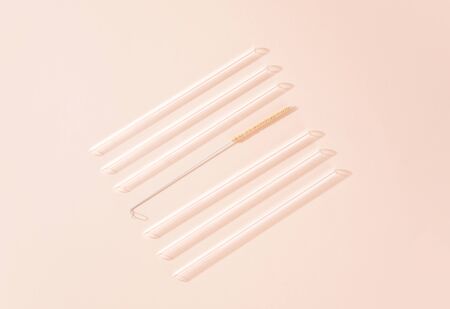 Minimalist composition of reusable glass straws. Overhead Shot.の写真素材