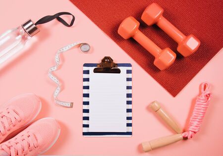 Flat lay shot of sneakers on orange background. Sport concept.の写真素材