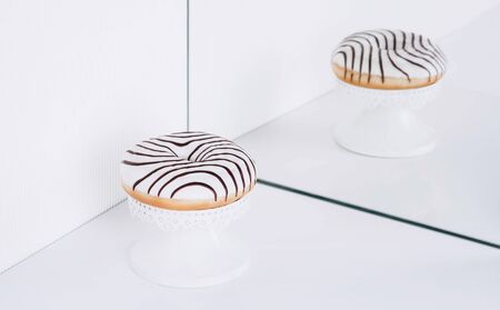Striped donuts on a white background. Stylish minimal conceptの写真素材