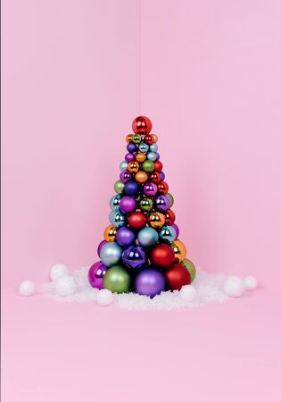 Creative Christmas design on pink pastel color background with Christmas tree. Xmas and holiday concept.の写真素材