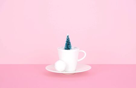 Creative Christmas design on pink pastel color background with Christmas tree. Xmas and holiday concept.の写真素材
