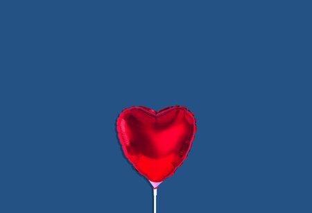 Red heart balloon isolated on trendy background. Color of the year 2019.の写真素材