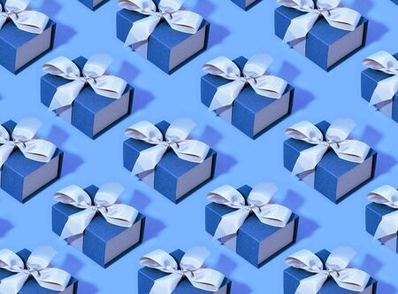 Pattern made of blue gift boxes on pastel background. Trendy colorの写真素材