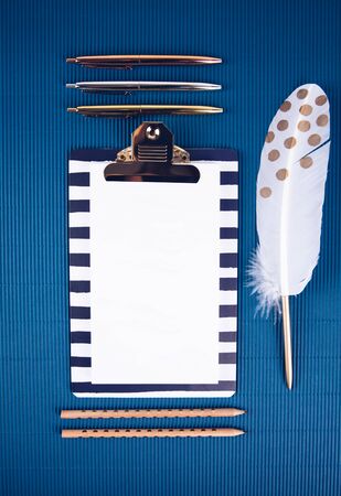 School supplies on a blue background. Trendy color. Overhead shoot.の写真素材
