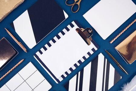 School supplies on a blue background. Trendy color 2020. Overhead shoot.の写真素材