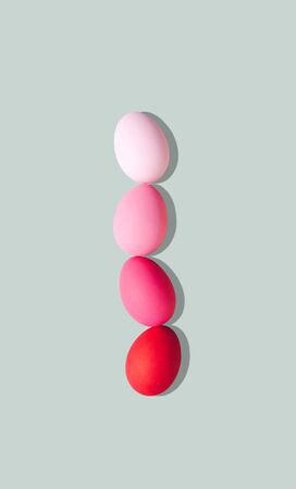 Painted eggs on pastel background. Creative minimal concept.の写真素材