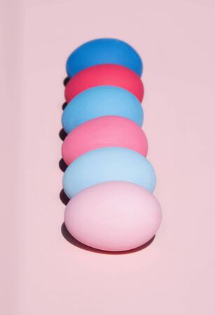 Painted eggs on pastel background. Creative minimal concept.の写真素材