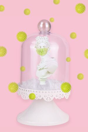 Gypsum statue with antiviral mask for protection against coronavirus, place for text.の写真素材
