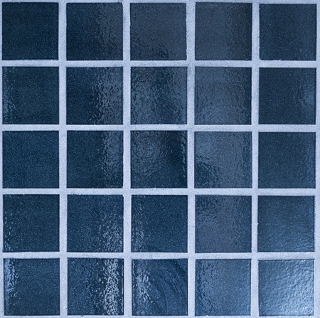 Close up of dark blue tiled wall