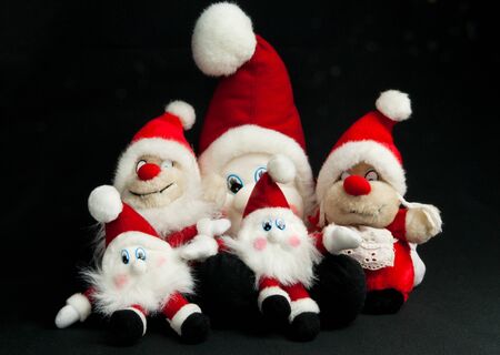Christmas toy elfs in different sizes with red hatsの写真素材