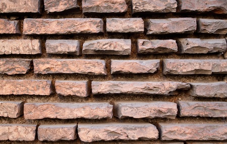 Old red brick wall with very recessed joints