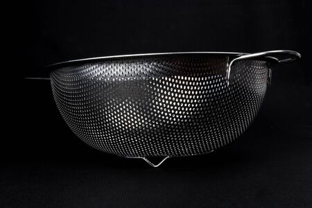 Stainless colander seen from beneathの写真素材