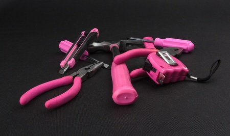 Pile of handy tools with pink handlesの写真素材