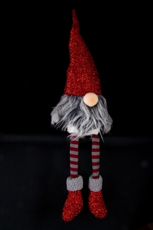 Sitting christmas elf with long grey hair and beardの写真素材