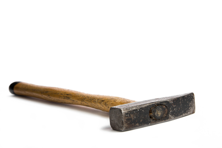 List hammer with wood handle lying on a white backgroundの写真素材